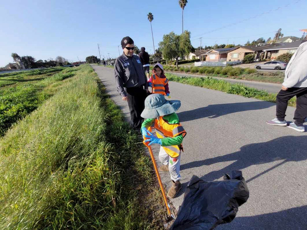 Volunteer family are cleaning the road